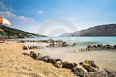 The pristine coastline and crystal clear water of the island of Stock Photo