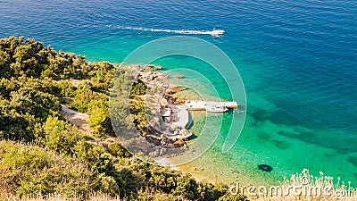 The pristine coastline and crystal clear water of the island of Stock Photo