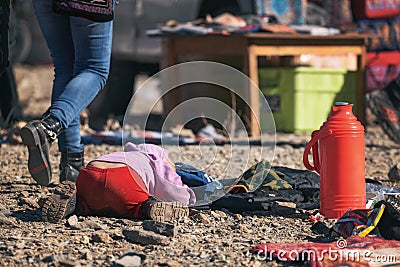 Pristine Mongolia. Mongolian Boy In Red Pants Sleeping On Stones Among Passing People During The Golden Eagle Hunters Festival. Ha Editorial Stock Photo