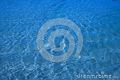 Pristine ocean water over sand Stock Photo