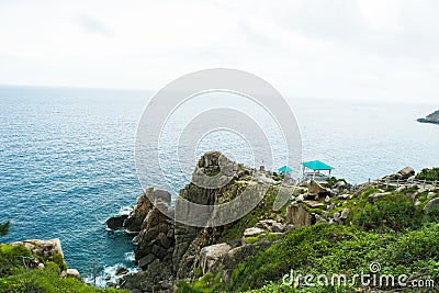 Pristine sea with rocky cliff at Dai Lanh cape point, Mui Dien, Phu Yen province, easternmost of Viet nam. Stock Photo