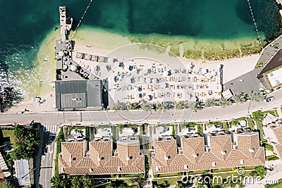 Private beach by the sea near the Huma Kotor Bay hotel. Dobrota, Montenegro. Drone Stock Photo