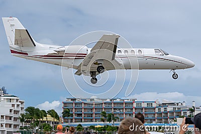 Private business jet aircraft preparing to land Stock Photo