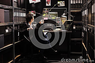 Private detective holding criminal investigations case files Stock Photo