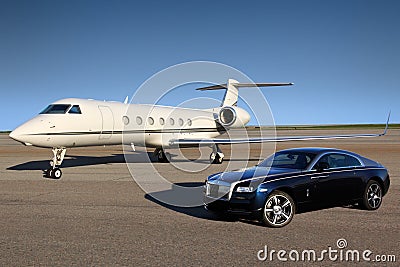 Private Gulfstream G550 executive airplane with Rolls Royce Wraith luxury car shown together at Sheremetyevo international airport Editorial Stock Photo