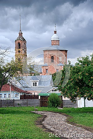 Private Houses and Church of Boris and Gleb before Storm Suzdal Stock Photo