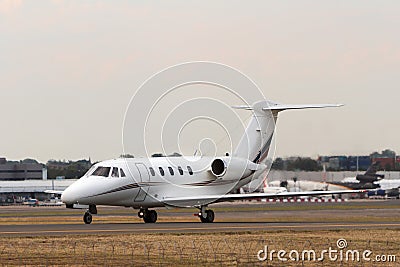 Private jet aircraft on runway Stock Photo