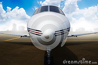 Private jet airplane parking at the airport. Stock Photo