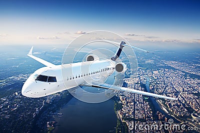 Private jet plane in the blue sky Stock Photo