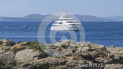 Private luxury Superyacht anchored off the beach of the spanish coastline at Rose Stock Photo