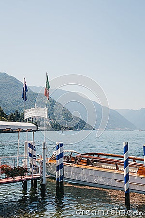 Private taxi boat moored by Bellagio Water Taxis Pier, Lake Como, Italy. Editorial Stock Photo