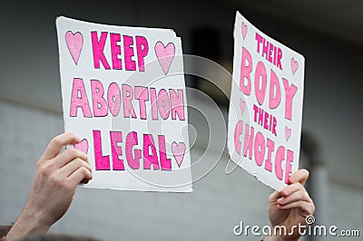 Pro choice Planned Parenthood demonstration holding two signs Stock Photo