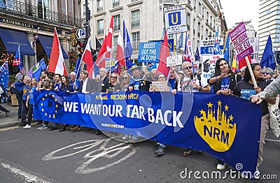 Pro-EU anti-Brexit supporters with main banner at the National Rejoin March in London. Editorial Stock Photo