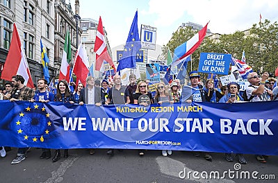 Pro-EU anti-Brexit supporters with main banner at the National Rejoin March in London. Editorial Stock Photo