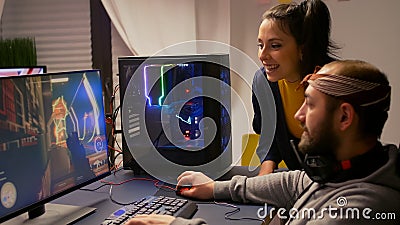 Pro gamer couple playing first person video game Stock Photo