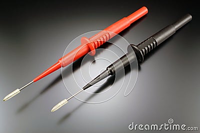 Probes for digital multimeter on a black background Stock Photo