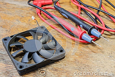 Probes for a multimeter and electronic components on a table in a workshop Stock Photo