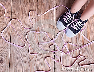 The problem - child feet and shoelaces Stock Photo