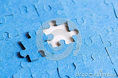 Problem solved concept - placing last piece of puzzle Stock Photo
