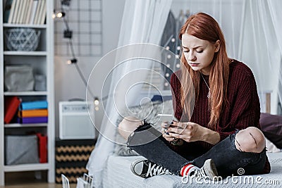 Problematic teenager using smartphone Stock Photo