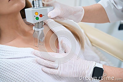 Procedure of laser removal of neoplasms in a cosmetology clinic close-up Stock Photo