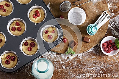 The process of baking delicious muffins with berries, white cream, chocolate Stock Photo