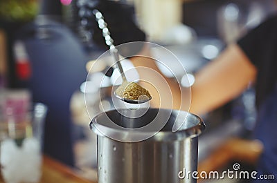 Process of bartending in bar,pouring a tablespoon of brown sugar in shaker Stock Photo
