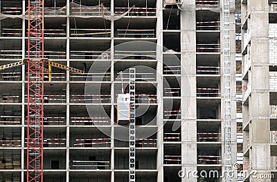 Process of construction modern apartment building wall front view with liftz Stock Photo