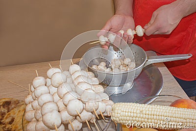 Process of cooking a delicious mushrooms - hands Stock Photo