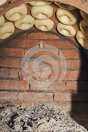 Process of cooking tandoor bread national Uzbek flatbread Stock Photo