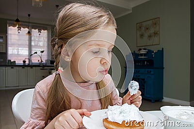 Process of decorating a cake with sweet colored decorations Stock Photo