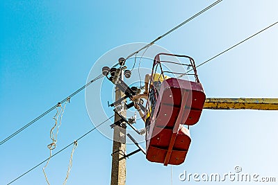 The process of installing an electrical disconnector using a hoist Stock Photo