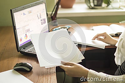 The process of with a laptop and documents on a Office desk Stock Photo