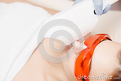 Process laser hair removal mustache treatment in salon young woman having. Stock Photo