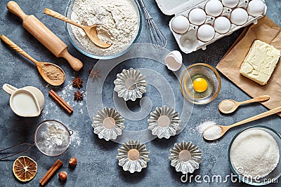 The process of making cake dough. Baking ingredients for homemade pastry on dark background. Top view, flat lay Stock Photo
