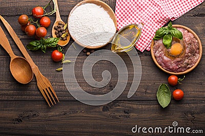 The process of making Food background for tasty Italian dishes with tomato. Various cooking ingredients with spaghetti and spoon. Stock Photo