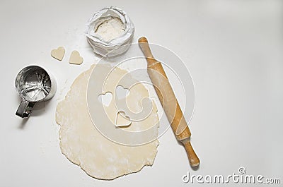 Making homemade sugar cookies in the shape of a heart. A gift for Valentine's Day Stock Photo