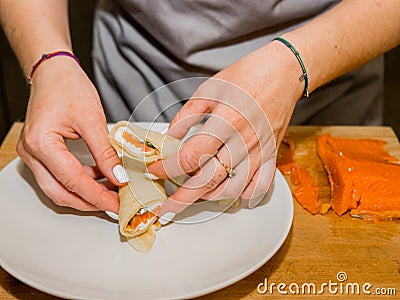 The process of making pancakes. Cook in the kitchen makes the dough Stock Photo