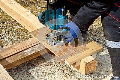 The process of milling wood with a circular machine. Passion for wood carving. Golden hand Stock Photo