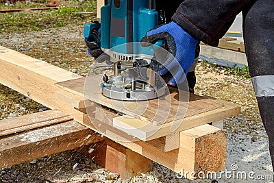 The process of milling wood with a circular machine. Passion for wood carving. Golden hand Stock Photo