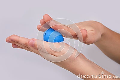 The process of play dough modeling, the child`s hands sculpt figures. Stock Photo