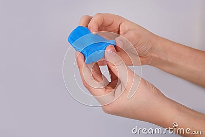 The process of play dough modeling, the child`s hands sculpt figures. Stock Photo