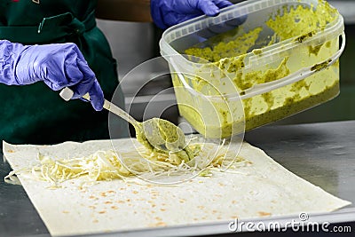 Process of preparing appetizing roll with falafel. Vegetarian fo Stock Photo