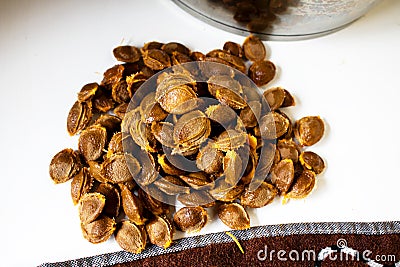 The process of producing apricot jam at home. Pits from freshly peeled apricots Stock Photo