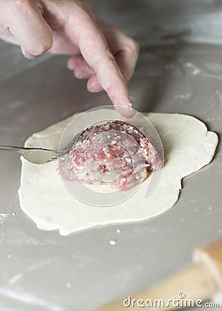 The process of sculpting meat dumplings. Stock Photo