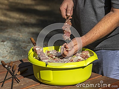 Process of skewering kebab meat Stock Photo