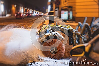Process of snow removal on the city streets and roads with municipal vehicle, bulldozer, snowblower plow truck, snowplow, snow Stock Photo