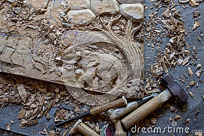 The Process of Wood Hand-Carving Elephants 3D Wood Hand Carved Wall Decor Panel Hand Made Teak Wood Wall Art Stock Photo