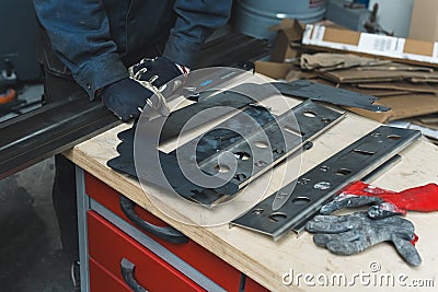 process of the working at the factory, man using instruments standing at the table, guitar production Stock Photo