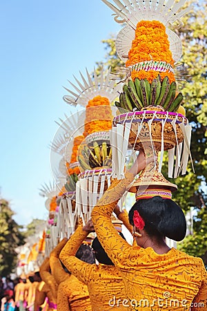 Procession of Balinese women carrying on religious offering Editorial Stock Photo